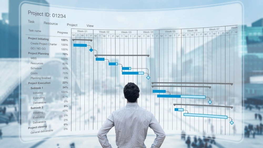 project management software viewed by a man standing