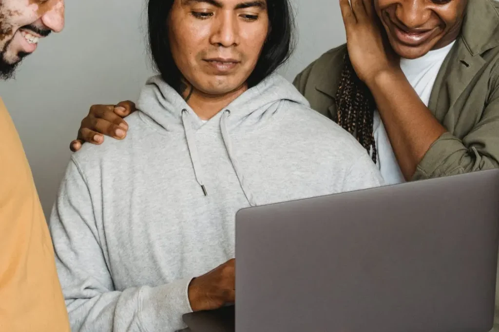 a man looking at a laptop